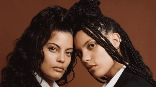 Ibeyi sisters posing with their heads together